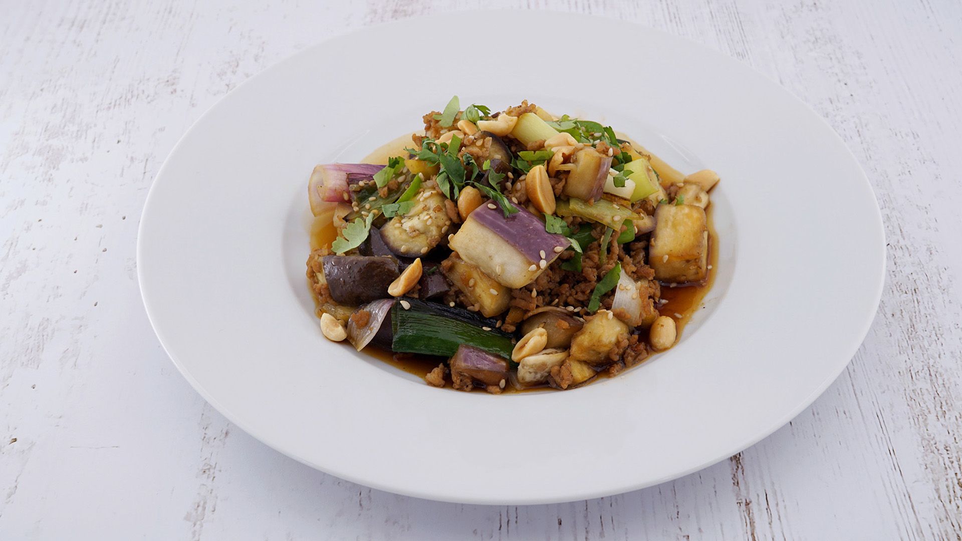 Melanzani mit Schweinefleisch aus dem Wok