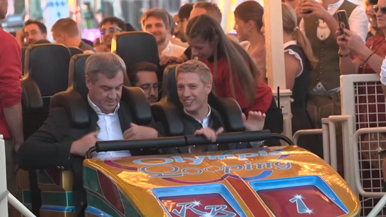 Olympia-Wette auf Wiesn eingelöst: Söder und Krause fahren Olympia-Looping