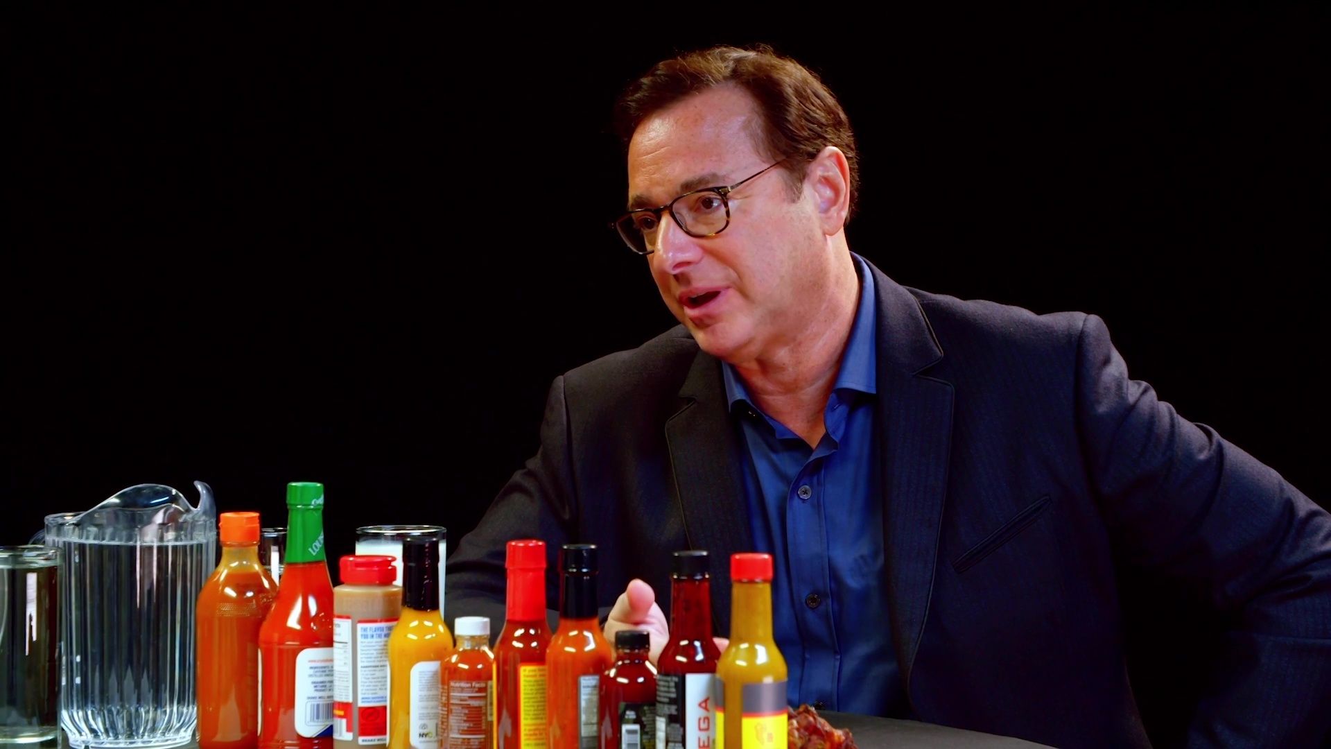 Bob Saget Hiccups Uncontrollably While Eating Spicy Wings