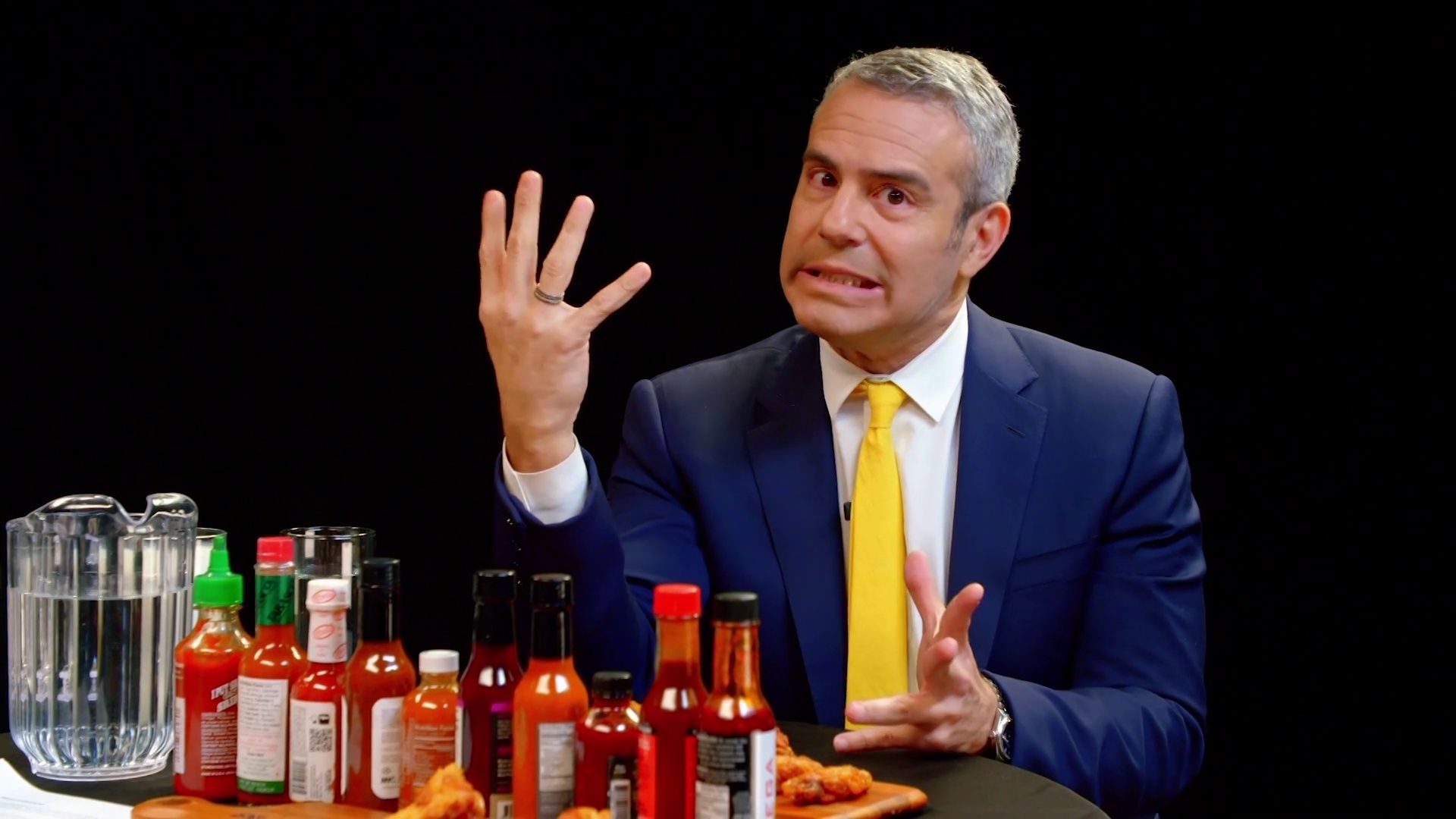Andy Cohen Spills the Tea While Eating Spicy Wings