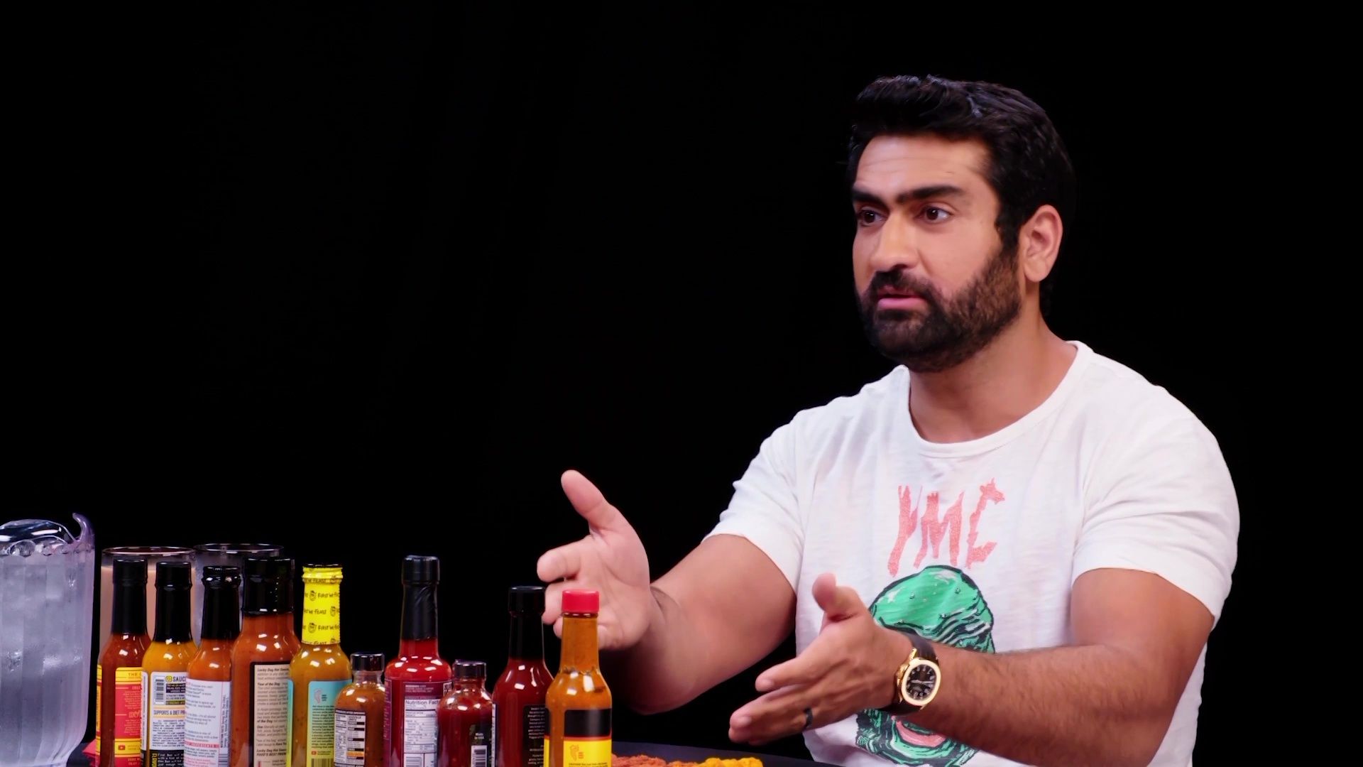 Kumail Nanjiani Sweats Intensely While Eating Spicy Wings