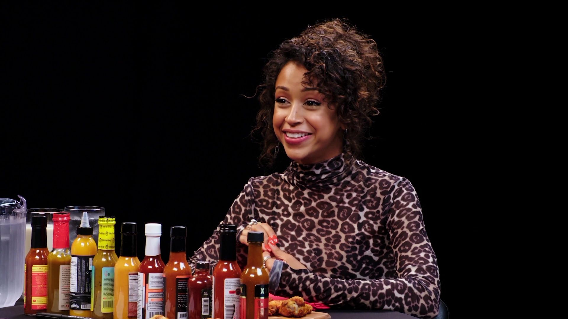 Liza Koshy Meets Her Future Self While Eating Spicy Wings